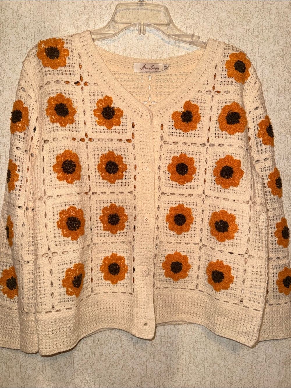 Crocheted Cream Cardigan with Orange Floral Motifs
